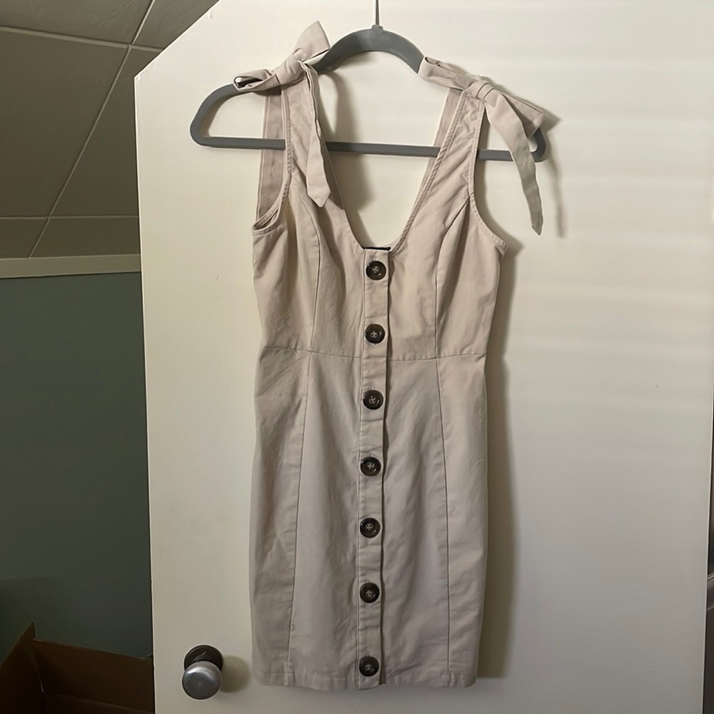Canvas tan dress with brown buttons and faux tie straps